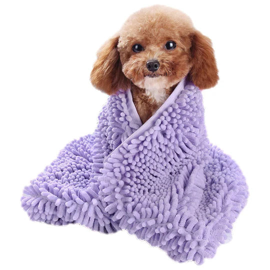 A dog wrapped in a quick-dry bath towel